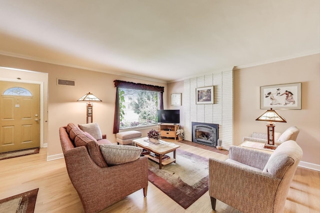 222 Cornell Ave, Des Plaines, IL 60016 - living area with crown molding, light wood-type flooring, and a fireplace