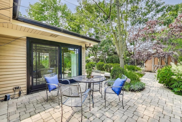222 Cornell Ave, Des Plaines, IL 60016 - view of patio with a shed and outdoor dining area