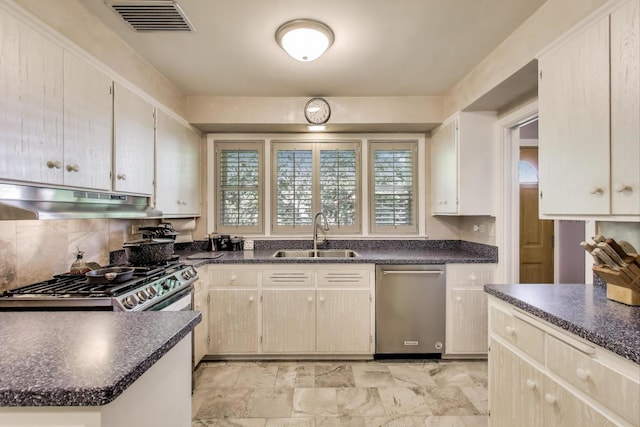 222 Cornell Ave, Des Plaines, IL 60016 - kitchen featuring under cabinet range hood, dishwasher, dark countertops, and decorative backsplash