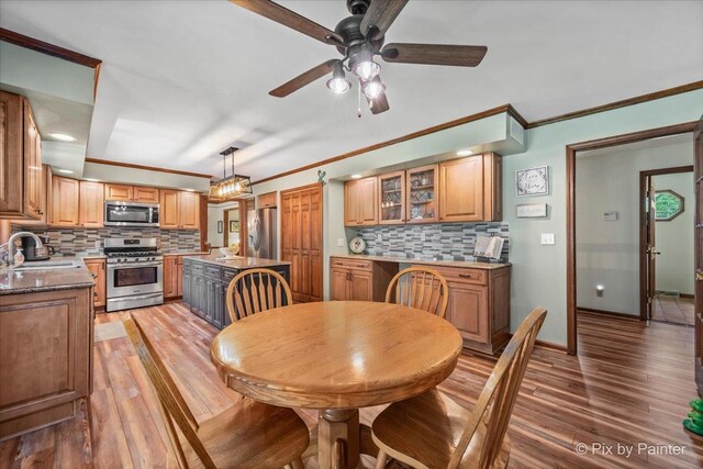 2N445 Beith Rd, Elburn, IL 60119 - dining room featuring a ceiling fan, light wood finished floors, and ornamental molding