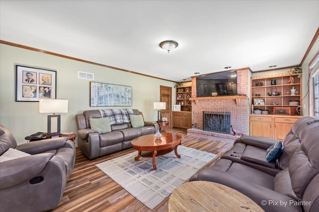 2N445 Beith Rd, Elburn, IL 60119 - living area featuring ornamental molding, wood finished floors, and a fireplace