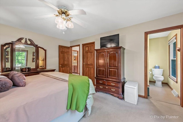 2N445 Beith Rd, Elburn, IL 60119 - bedroom with light colored carpet, connected bathroom, and ceiling fan