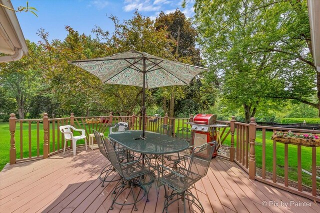 2N445 Beith Rd, Elburn, IL 60119 - wooden deck featuring a lawn, outdoor dining space, and view of scattered trees