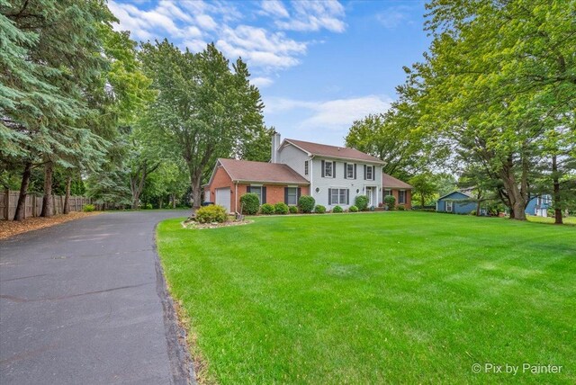 2N445 Beith Rd, Elburn, IL 60119 - colonial home featuring a chimney and driveway