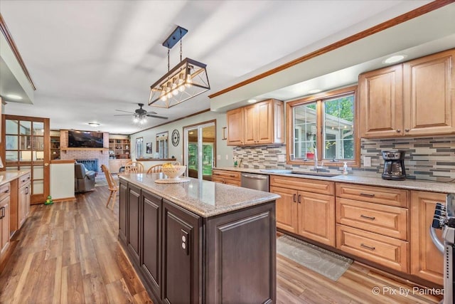2N445 Beith Rd, Elburn, IL 60119 - kitchen featuring dishwasher, healthy amount of natural light, tasteful backsplash, light wood finished floors, and crown molding