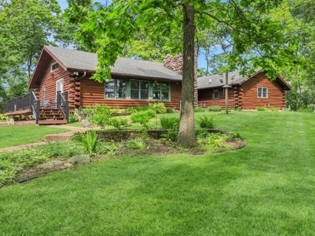 N1508 Wildwood Rd, Linn, WI 53147 - back of house featuring log exterior, a yard, and a wooden deck