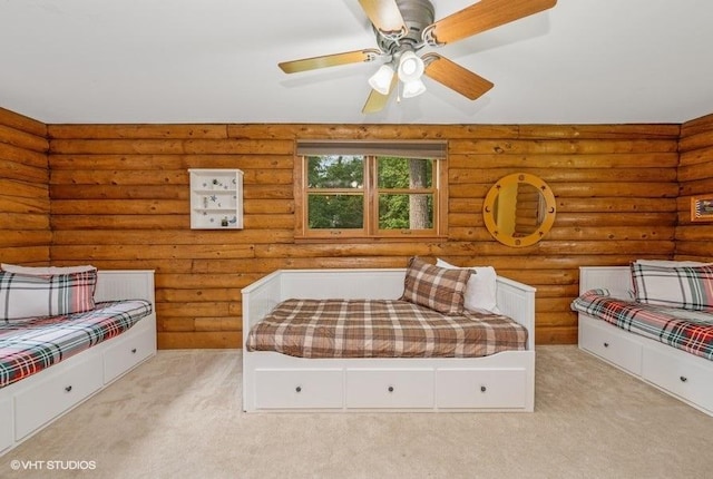 N1508 Wildwood Rd, Linn, WI 53147 - bedroom with light carpet, log walls, and ceiling fan