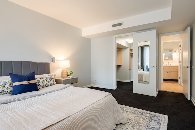 201 E Chestnut St Unit 21F, Chicago, IL 60611 - bedroom featuring dark colored carpet, a walk in closet, and a closet