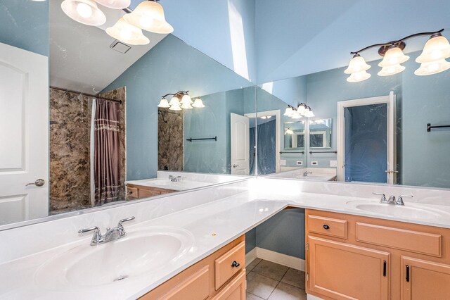 31 E Shagbark Ln, Streamwood, IL 60107 - bathroom with tile patterned floors, double vanity, lofted ceiling, and a shower with curtain