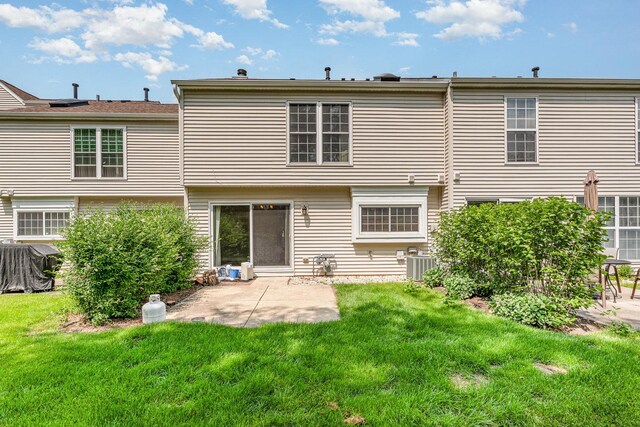 31 E Shagbark Ln, Streamwood, IL 60107 - rear view of house featuring a patio and a lawn