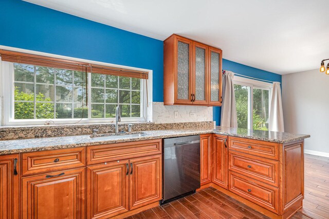 31 E Shagbark Ln, Streamwood, IL 60107 - kitchen featuring dishwasher, a peninsula, dark wood-style flooring, and light stone counters