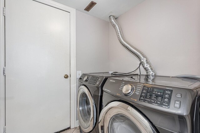 31 E Shagbark Ln, Streamwood, IL 60107 - washroom featuring independent washer and dryer and tile patterned flooring