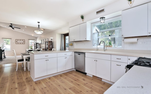 21136 W Engle Dr, Lake Villa, IL 60046 - kitchen with dishwasher, light wood finished floors, a peninsula, white cabinets, and lofted ceiling