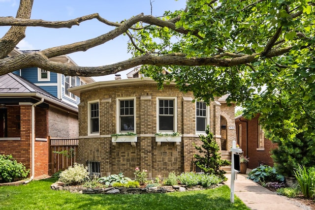 7439 N Maplewood Ave, Chicago, IL 60645 - view of front of home featuring brick siding
