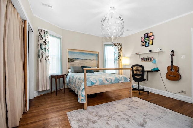 7439 N Maplewood Ave, Chicago, IL 60645 - bedroom featuring ornamental molding and wood finished floors