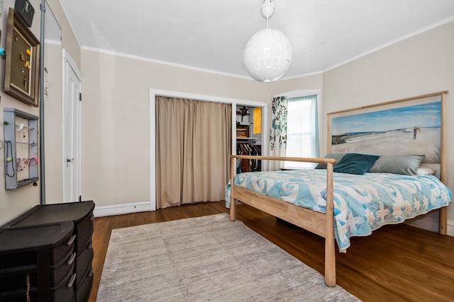 7439 N Maplewood Ave, Chicago, IL 60645 - bedroom with wood finished floors and crown molding