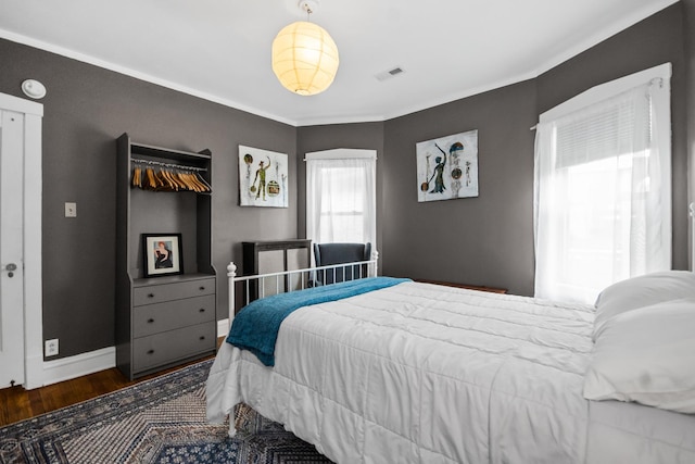 7439 N Maplewood Ave, Chicago, IL 60645 - bedroom featuring wood finished floors and crown molding