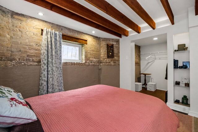 7439 N Maplewood Ave, Chicago, IL 60645 - bedroom featuring beamed ceiling, wood finished floors, a closet, and recessed lighting