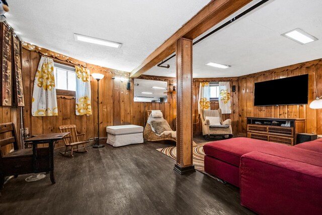 7439 N Maplewood Ave, Chicago, IL 60645 - living area with wooden walls, wood finished floors, and healthy amount of natural light