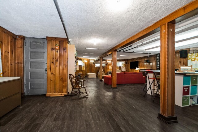 7439 N Maplewood Ave, Chicago, IL 60645 - misc room with wood finished floors, wooden walls, and a textured ceiling