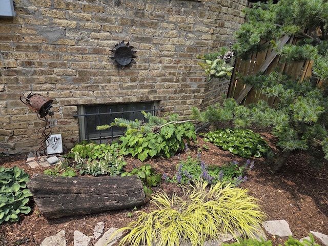 7439 N Maplewood Ave, Chicago, IL 60645 - exterior view of an outdoor brick fireplace and brick siding