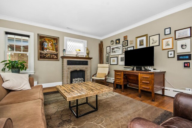 7439 N Maplewood Ave, Chicago, IL 60645 - living area with crown molding, wood finished floors, a brick fireplace, and a baseboard heating unit