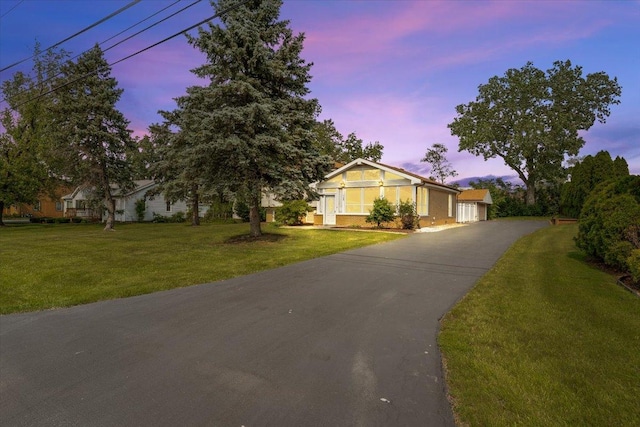145 N Oakleaf Dr, Addison, IL 60101 - view of front of property featuring a front lawn and a garage