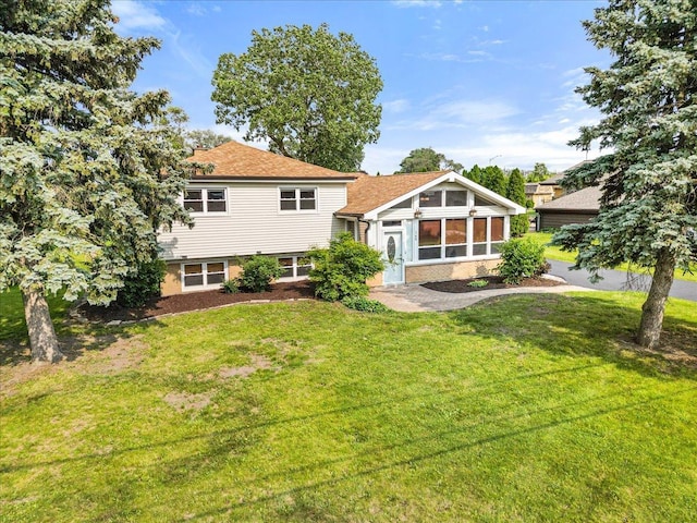 145 N Oakleaf Dr, Addison, IL 60101 - back of property with a yard and a shingled roof