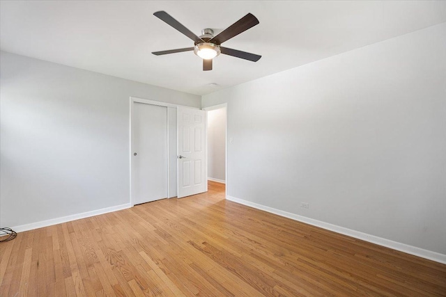 145 N Oakleaf Dr, Addison, IL 60101 - unfurnished bedroom featuring light wood-style flooring, a closet, and a ceiling fan