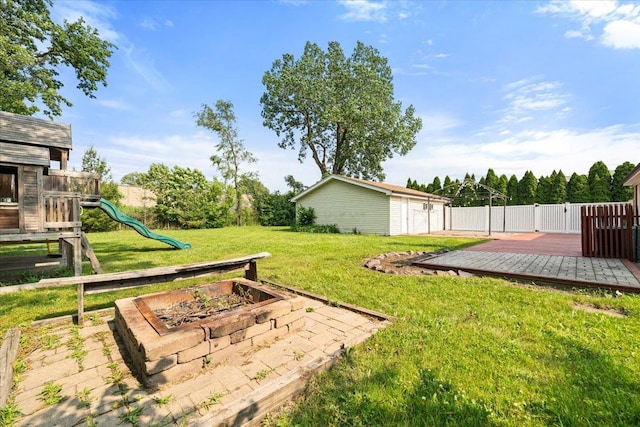 145 N Oakleaf Dr, Addison, IL 60101 - view of yard with a wooden deck, a playground, and an outdoor structure
