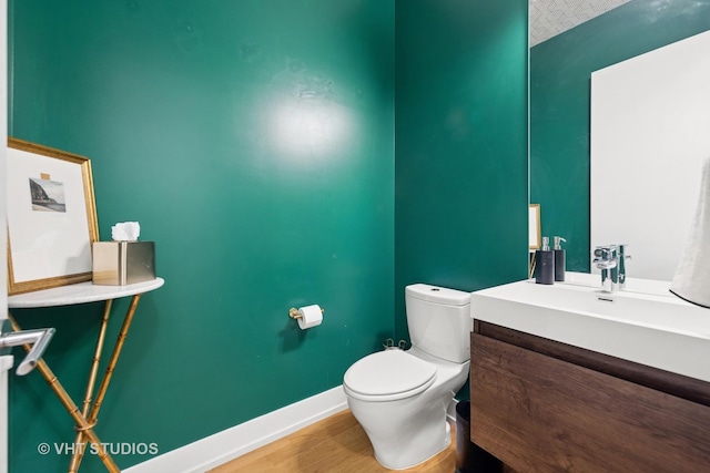 5236 N Kenmore Ave Unit 1N, Chicago, IL 60640 - half bathroom featuring vanity and wood finished floors
