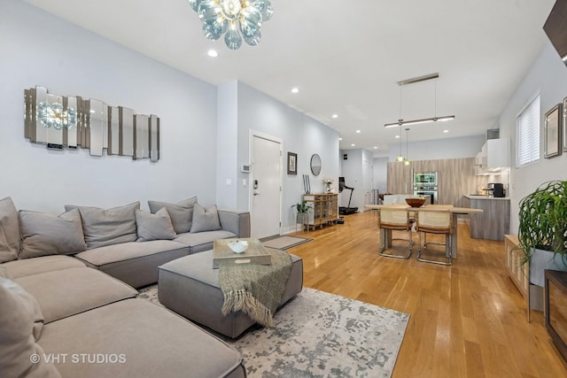 5236 N Kenmore Ave Unit 1N, Chicago, IL 60640 - living room featuring light wood-style flooring, a chandelier, and recessed lighting