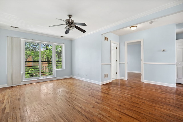 2554 W Rosemont Ave Unit 3, Chicago, IL 60659 - unfurnished room featuring wood finished floors, a ceiling fan, and crown molding