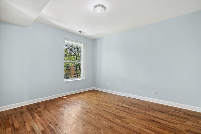 2554 W Rosemont Ave Unit 3, Chicago, IL 60659 - spare room with wood finished floors and baseboards