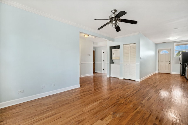 2554 W Rosemont Ave Unit 3, Chicago, IL 60659 - unfurnished living room featuring wood finished floors, ornamental molding, and a ceiling fan