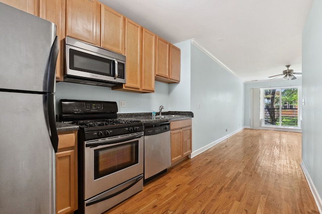 2554 W Rosemont Ave Unit 3, Chicago, IL 60659 - kitchen featuring appliances with stainless steel finishes, light wood-type flooring, crown molding, light brown cabinetry, and ceiling fan