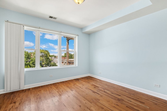 2554 W Rosemont Ave Unit 3, Chicago, IL 60659 - spare room featuring baseboards and wood finished floors