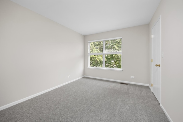 905 Huntington Dr, Elk Grove Village, IL 60007 - carpeted empty room featuring baseboards