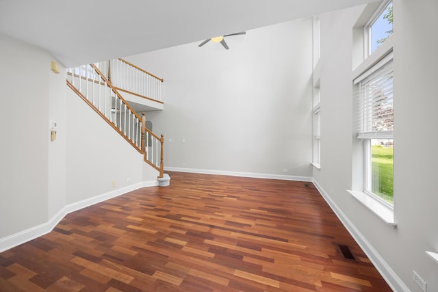 905 Huntington Dr, Elk Grove Village, IL 60007 - unfurnished living room featuring a ceiling fan, wood finished floors, and stairway