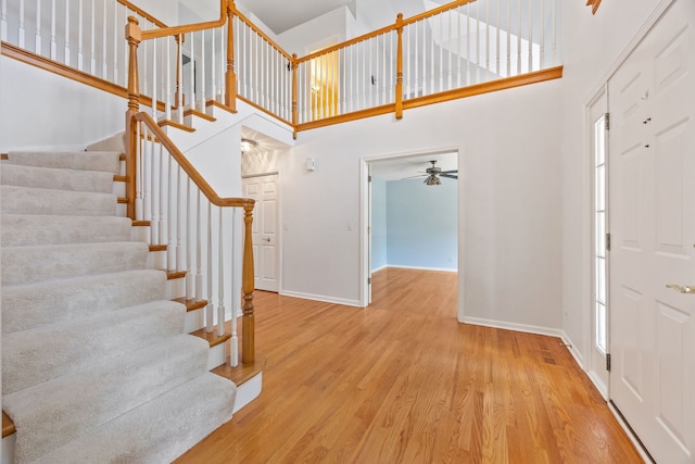 2319 Cloverdale Rd, Naperville, IL 60564 - foyer featuring a high ceiling, stairs, wood finished floors, and a ceiling fan