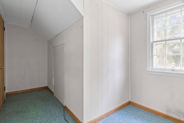 418 S Vail Ave, Arlington Heights, IL 60005 - unfurnished room featuring tile patterned floors, vaulted ceiling, and wood walls
