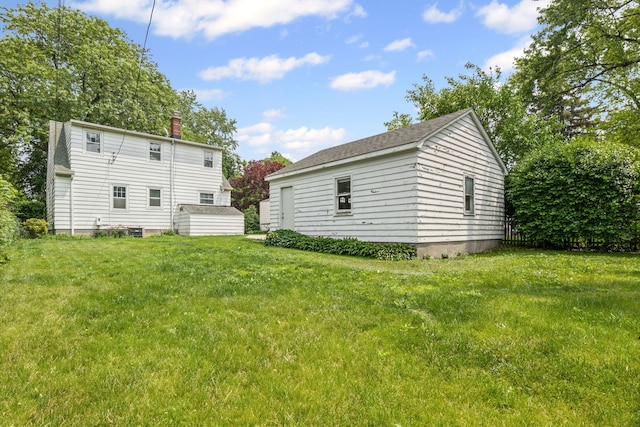 418 S Vail Ave, Arlington Heights, IL 60005 - rear view of house with a chimney and a yard