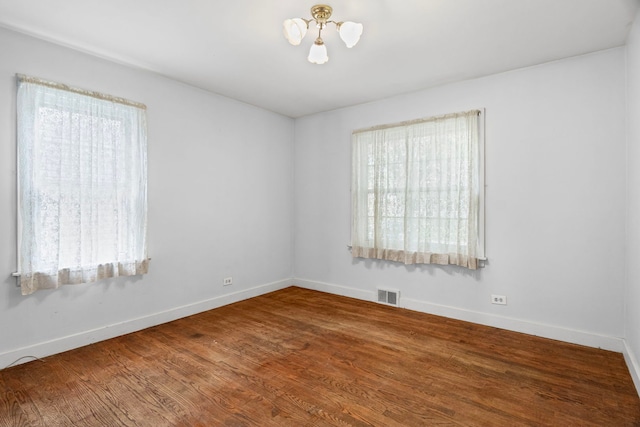 418 S Vail Ave, Arlington Heights, IL 60005 - spare room with plenty of natural light, a chandelier, and wood finished floors