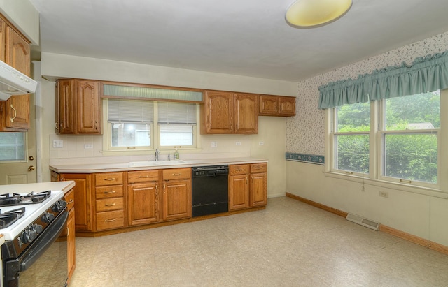 333 Elm St, Glen Ellyn, IL 60137 - kitchen with black dishwasher, brown cabinetry, gas stove, and wallpapered walls