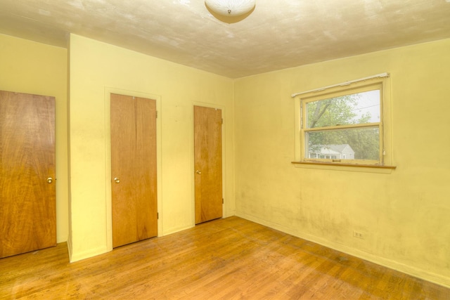 333 Elm St, Glen Ellyn, IL 60137 - unfurnished bedroom featuring wood finished floors