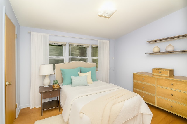 333 Elm St, Glen Ellyn, IL 60137 - bedroom featuring light wood finished floors and vaulted ceiling