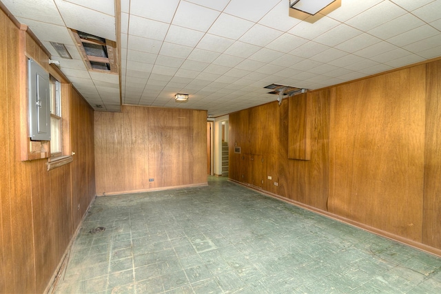 333 Elm St, Glen Ellyn, IL 60137 - spare room with wood walls and tile patterned floors