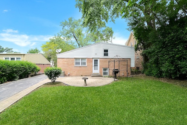 333 Elm St, Glen Ellyn, IL 60137 - rear view of house with a yard, a patio area, and brick siding