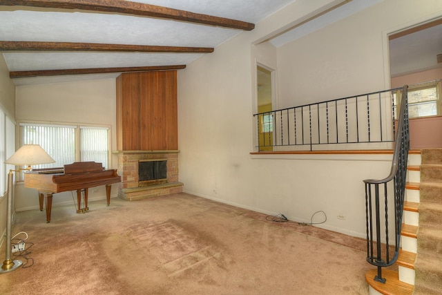 333 Elm St, Glen Ellyn, IL 60137 - unfurnished living room featuring carpet, plenty of natural light, stairs, and a fireplace with raised hearth