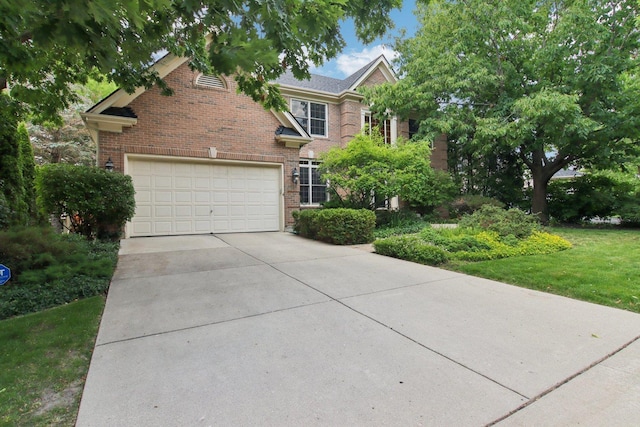 1560 Fairway Cir, Geneva, IL 60134 - view of front of property with concrete driveway, a garage, and brick siding